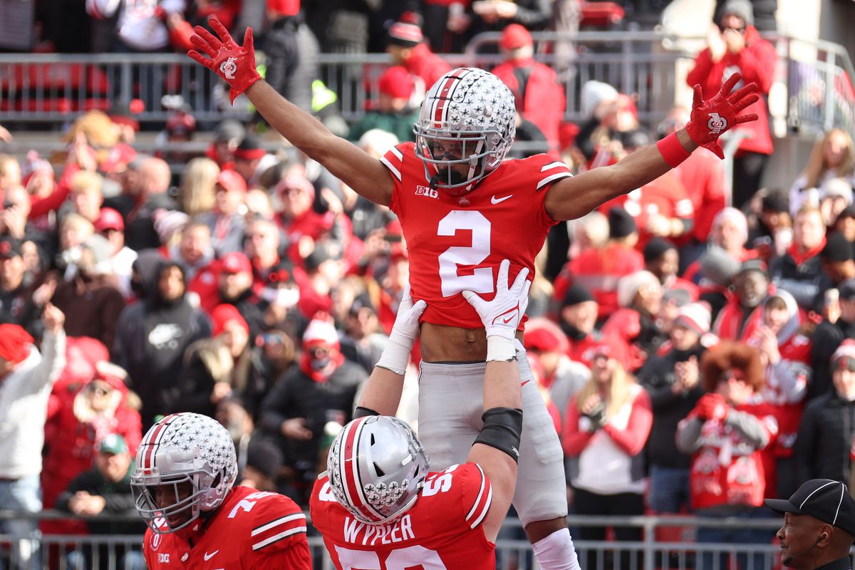 Chris Olave #2 of the Ohio State Buckeyes celebrates a first half touchdown catch against the Michigan State Spartans with Luke Wypler #53 of the Ohio State Buckeyes at Ohio Stadium on November 20, 2021 in Columbus, Ohio.