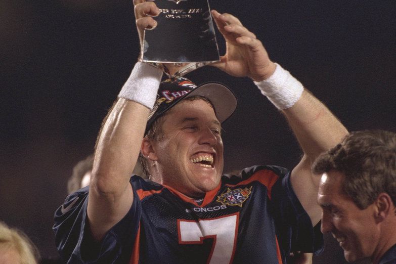 John Elway hoists the Lombardi Trophy after Super Bowl XXXII (landscape)