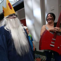 Cory Wilson, as the Ice King from "Adventure Time," and Kristine Alexakos, as Marceline from "Adventure Time," wait in line to get into Utah's first Comic Con at the Salt Palace Convention Center in Salt Lake City on Thursday, Sept. 5, 2013.