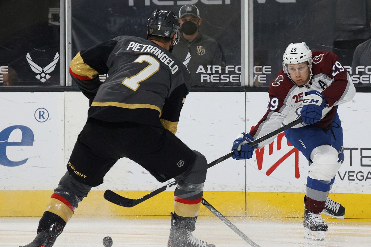 Nathan MacKinnon #29 of the Colorado Avalanche passes against Alex Pietrangelo #7 of the Vegas Golden Knights in the first period of their game at T-Mobile Arena on May 10, 2021 in Las Vegas, Nevada.