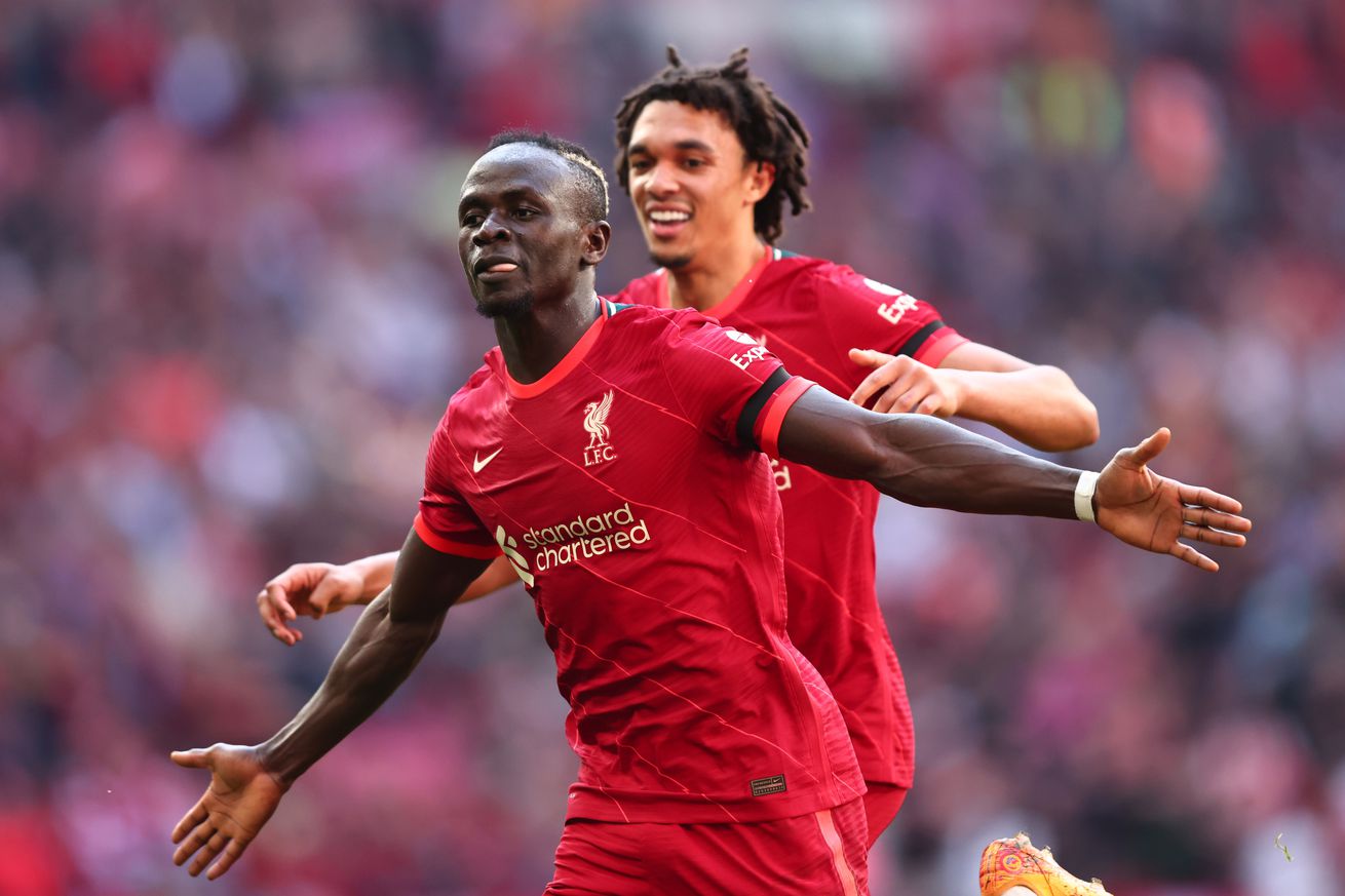 Sadio Mane of Liverpool celebrates with Trent Alexander-Arnold during The Emirates FA Cup Semi-Final match between Manchester City and Liverpool at Wembley Stadium on April 16, 2022 in London, England.