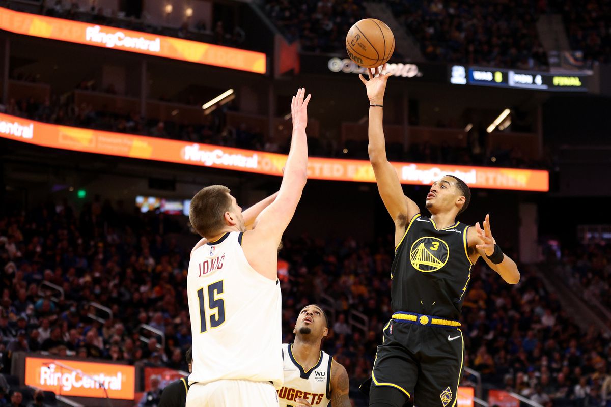 Jordan Poole #3 of the Golden State Warriors shoots over Nikola Jokic #15 of the Denver Nuggets in the second half during Game One of the Western Conference First Round NBA Playoffs at Chase Center on April 16, 2022 in San Francisco, California.