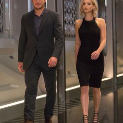 Jim (Chris Pratt) and Aurora (Jennifer Lawrence) walk through the hibernation bay on date night in “Passengers."