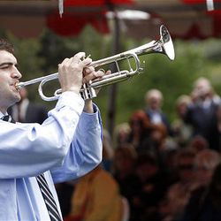 Parker Hill plays a trumpet medley during a memorial service conducted by the U.'s School of Medicine.  