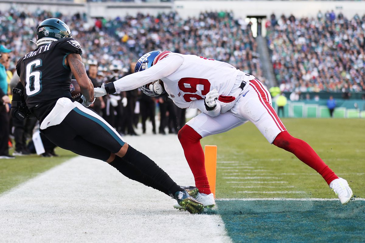 DeVonta Smith #6 of the Philadelphia Eagles catches the ball in front of Xavier McKinney #29 of the New York Giants for a touchdown during the third quarter at Lincoln Financial Field on December 26, 2021 in Philadelphia, Pennsylvania.