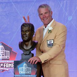 Brett Favre poses with his Hall of Fame bust