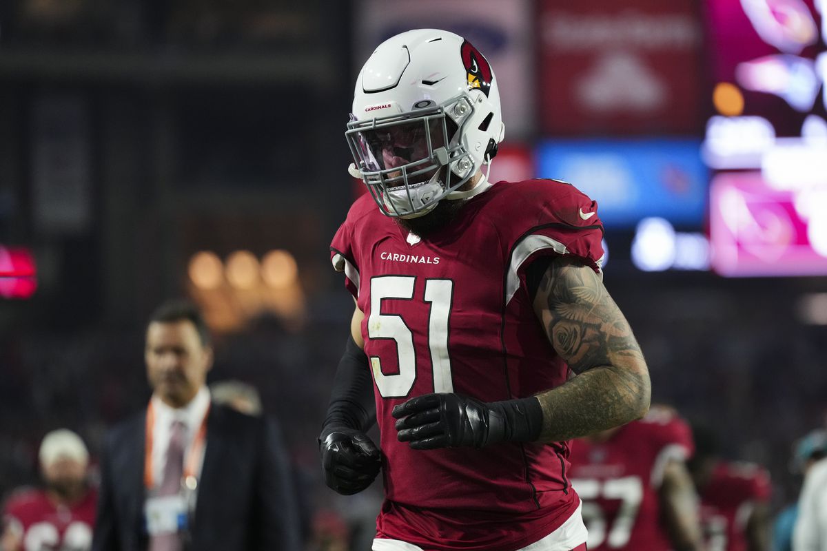 Tanner Vallejo #51 of the Arizona Cardinals runs off of the field against the New England Patriots at State Farm Stadium on December 12, 2022 in Glendale, Arizona.