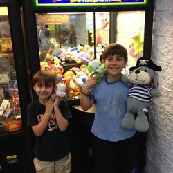 Kason (right) and Koleson Wright display their winnings the night the Toy Crane Project was hatched.