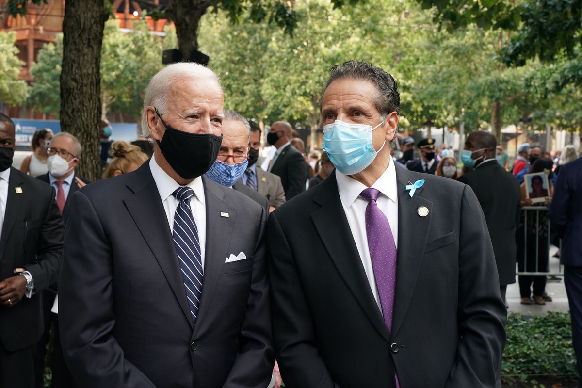 Gov. Andrew Cuomo speaks with former Vice President Joe Biden during a ceremony commemorating 9/11 victims.
