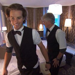 Salt Lake father/son team Connor, left, and David O'Leary must change into uniforms and clean a hotel room to meet Swiss standards in order to receive the next clue on the all-star edition of "The Amazing Race" on Sunday, April 27.