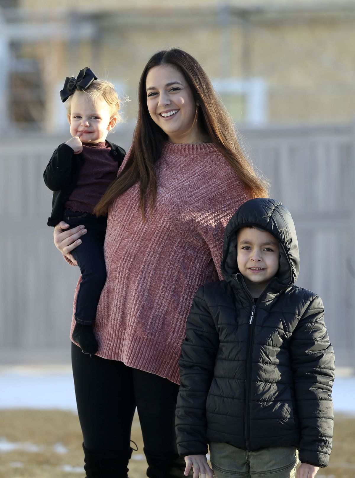Evi Figgat, center, is photographed with daughter Elinor and son Oliver at their Eagle Mountain home on Wednesday, Feb. 17, 2021.