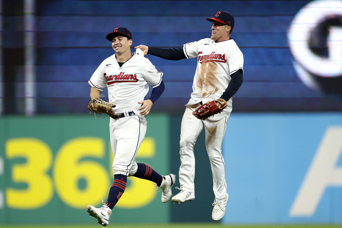 Will Brennan and Myles Straw of the Cleveland Guardians celebrate a 10-3 win against the Boston Red Sox at Progressive Field on June 08, 2023 in Cleveland, Ohio.