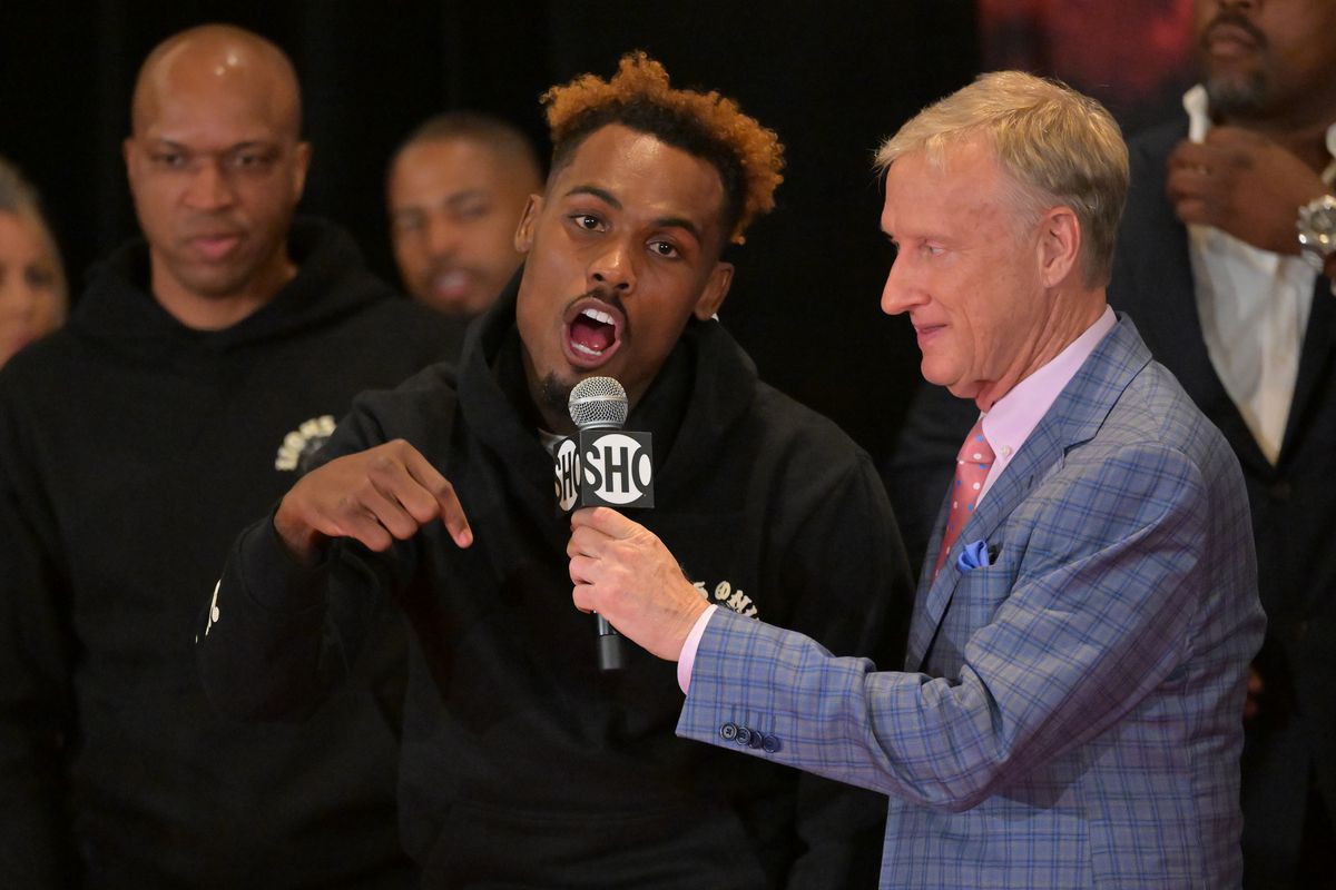 Jermell Charlo talks with ring announcer Jimmy Lennon Jr. at the weigh-in for his super welterweight championship fight against Brian Castano II being held at Dignity Health Sports Park,on May 13, 2022 in Los Angeles, California.