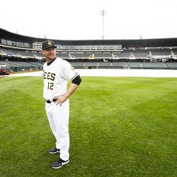 Bees' manager Lou Marson waits for the players to arrive on the field for a team photo as the Salt Lake Bees hold their media day at Smith's Ballpark on Tuesday, April 2, 2019.