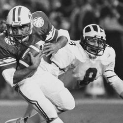 At left, Vai Sikahema of BYU makes a run during the Holiday Bowl in San Diego, California, Dec. 21, 1984.