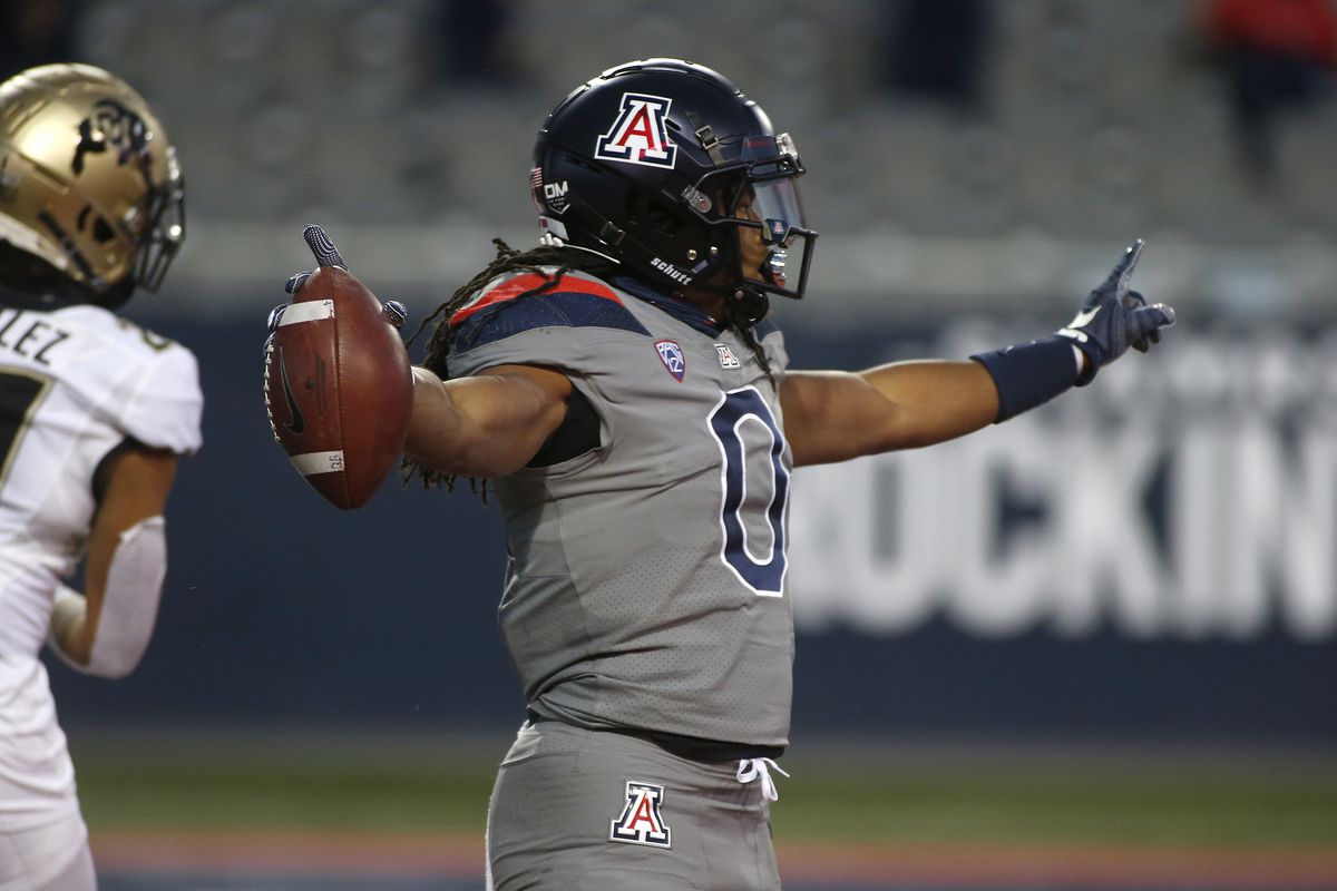 Running back Gary Brightwell #0 of the Arizona Wildcats celebrates after scoring a touchdown against the Colorado Buffaloes during the first half of the PAC-12 football game at Arizona Stadium on December 05, 2020 in Tucson, Arizona.