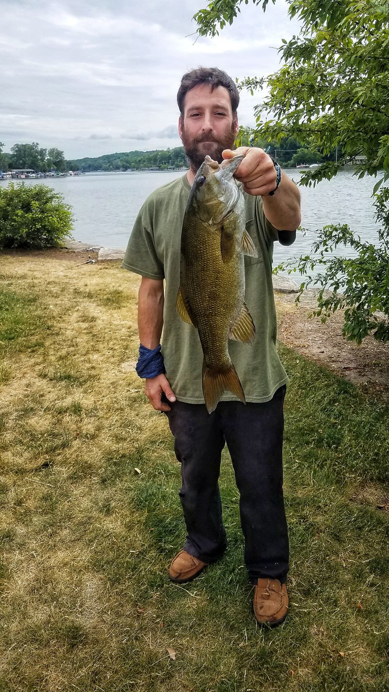 Chris Horvath with his best smallmouth bass of the year from the Fox River. Provided photo