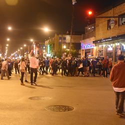 9:59 p.m. Patrons begin to spill out into the street, at Clark and Addison - 