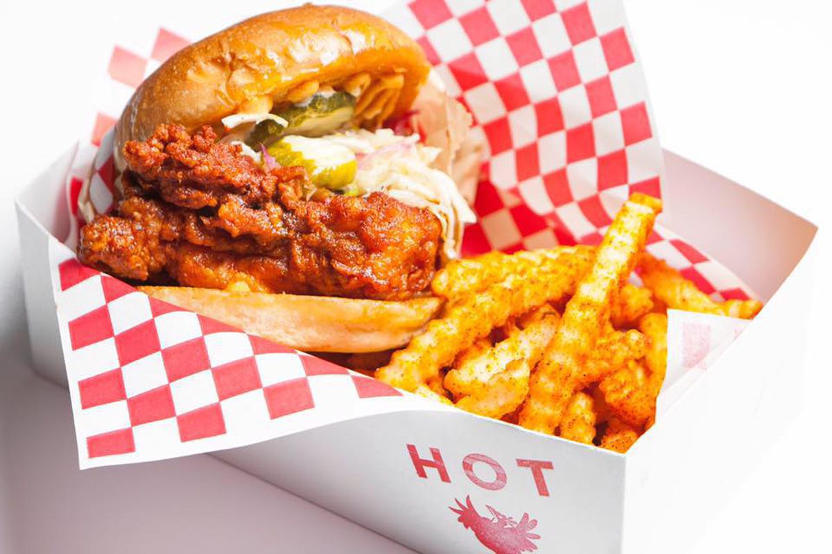A bright red spicy chicken and fries order from Howlin’ Ray’s.