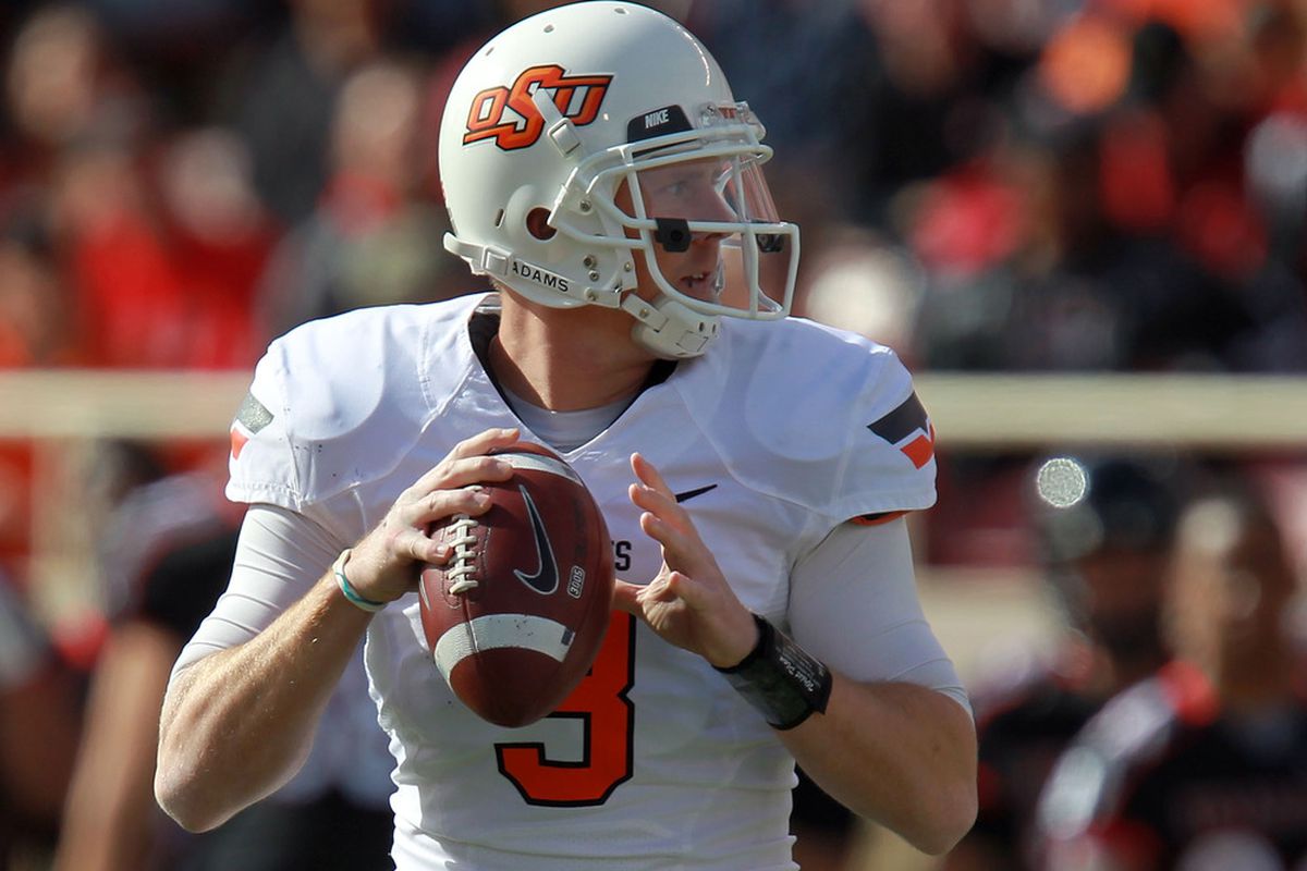 LUBBOCK, TX - NOVEMBER 12:  Brandon Weeden #3 of the Oklahoma State Cowboys throws against the Texas Tech Red Raiders at Jones AT&T Stadium on November 12, 2011 in Lubbock, Texas.  (Photo by Ronald Martinez/Getty Images)