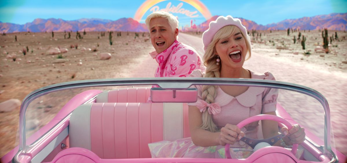 An image from the “Barbie” movie showing Barbie driving her car with Ken in the back seat.