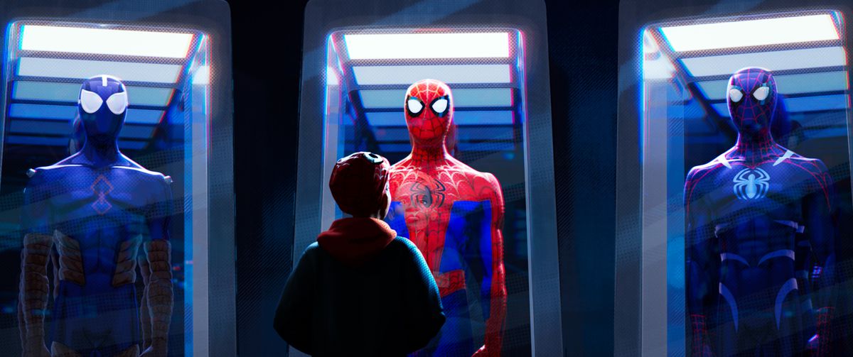 Miles Morales (Shameik Moore) looks at Spider-Man costumes in glass display cases in Sony Pictures Animation’s SPIDER-MAN: INTO THE SPIDER-VERSE.