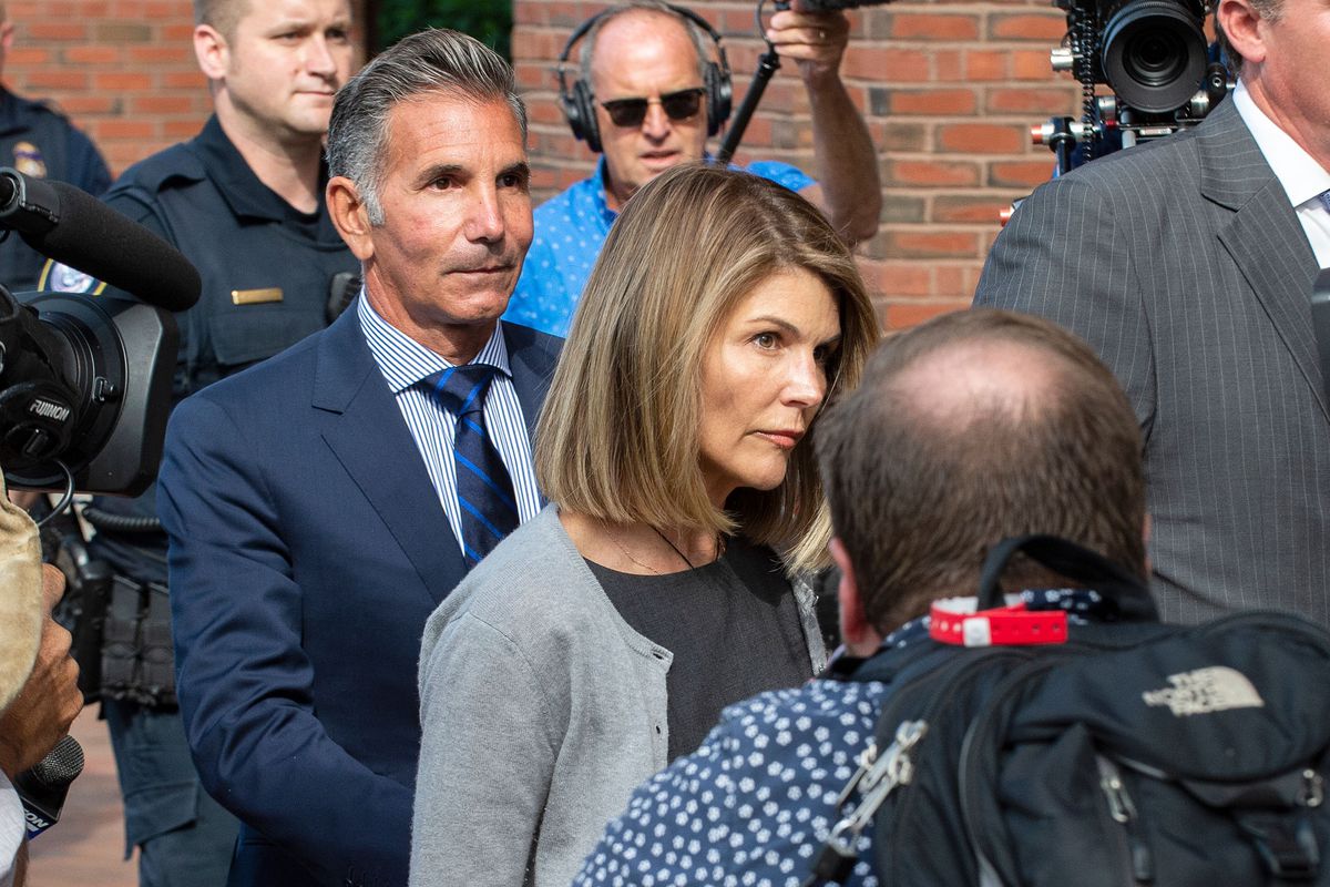 Actress Lori Loughlin and husband Mossimo Giannulli exit the Boston Federal Court house after a pre-trial hearing with Magistrate Judge Kelley at the John Joseph Moakley US Courthouse in Boston on August 27, 2019. 