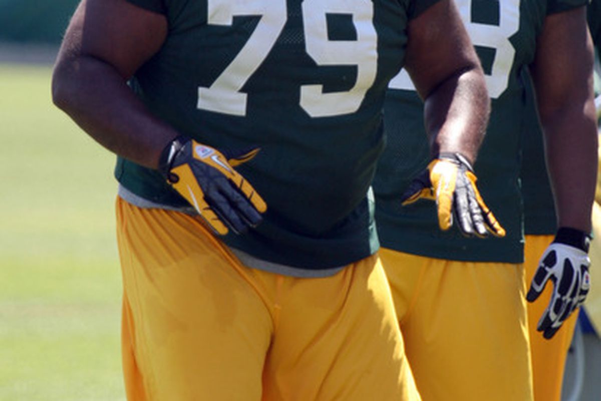 May 22, 2012; Green Bay, WI, USA; Green Bay Packers defensive tackle Ryan Pickett (79) waits his turn during drills at the Green Bay Packers organized team activities at Ray Nitschke Field. Mandatory Credit: Mary Langenfeld-US PRESSWIRE