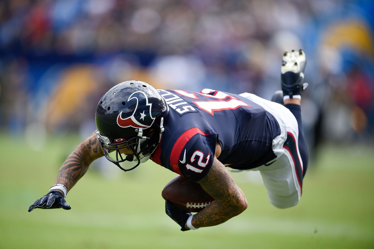 Houston Texans wide receiver Kenny Stills falls to the ground after a catch during the first half against the Los Angeles Chargers at Dignity Health Sports Park.