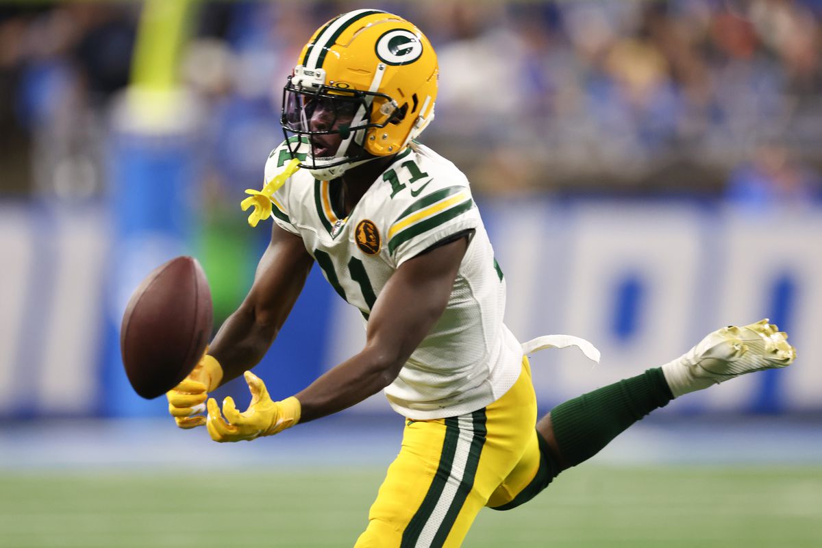 Jayden Reed #11 of the Green Bay Packers attempts to catch a pass against the Detroit Lions during the fourth quarter of the game at Ford Field on November 23, 2023 in Detroit, Michigan.