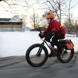 In a Feb.19, 2014 photo, Fraser Cunningham, 56, of Madeira, Ohio, a GE Engineer, bicycles home from work in single digit temperatures. Cunningham hasn't missed a day biking to and from work for a year and a half.