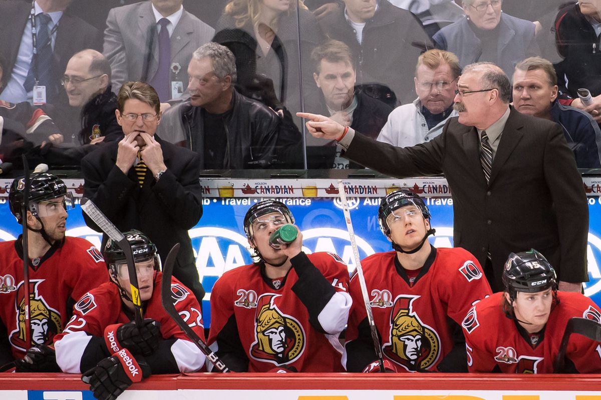 Apr 5, 2012; Ottawa, ON, CAN;  Ottawa Senators coach Paul MacLean (right) really hates it when assistant coach Mark Reeds whistles. Mandatory Credit: Marc DesRosiers-US PRESSWIRE