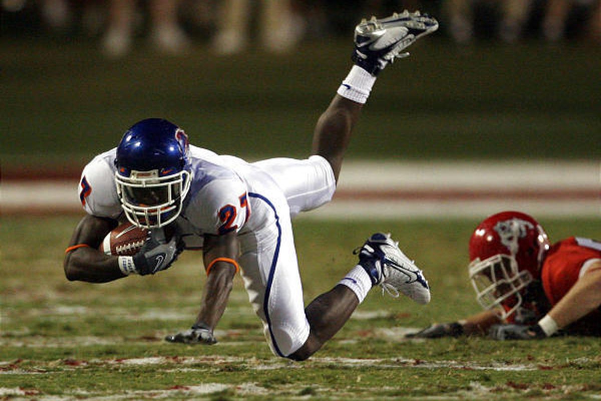 Boise State back Jeremy Avery, left, is tripped up at Fresno State.