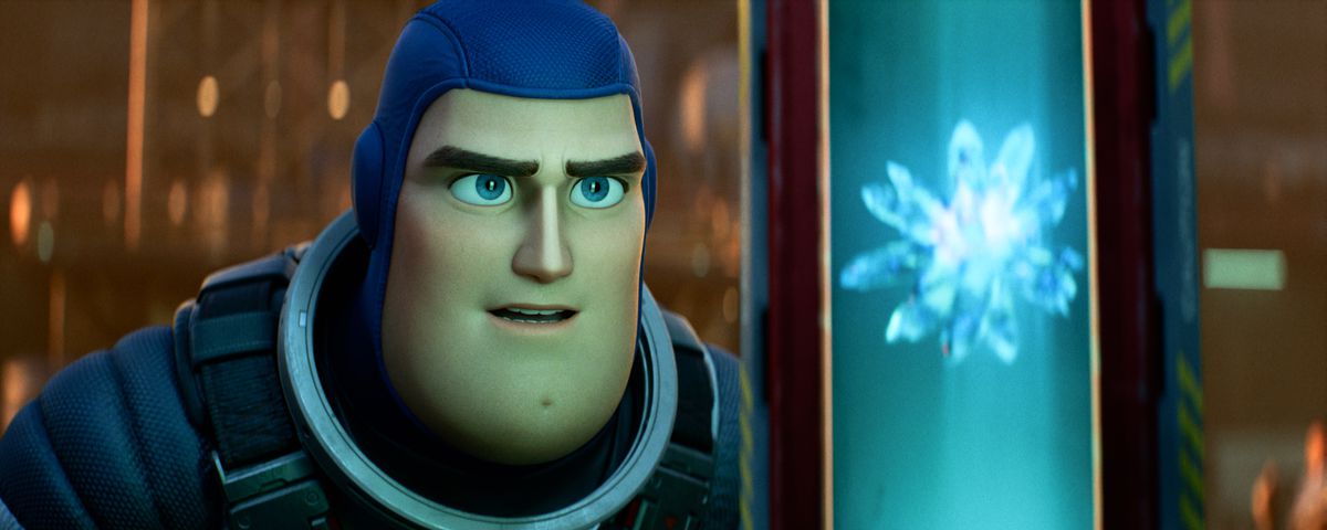 Buzz Lightyear looks at a shiny floating crystal in the Pixar movie Lightyear