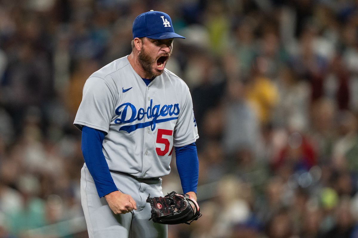 Relief pitcher Ryan Brasier of the Los Angeles Dodgers reacts after the final out of the eighth inning against the Seattle Mariners at T-Mobile Park on September 16, 2023 in Seattle, Washington.