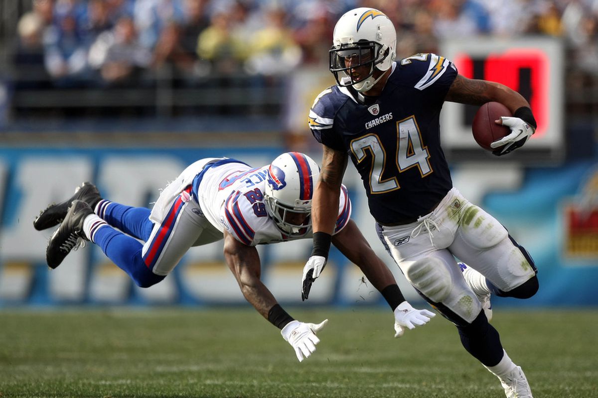SAN DIEGO, CA:  Running back Ryan Mathews #24 of the San Diego Chargers runs against the tackle of Drayton Florence #29 of the Buffalo Bills during their NFL Game at Qualcomm Stadium in San Diego, California. (Photo by Donald Miralle/Getty Images)