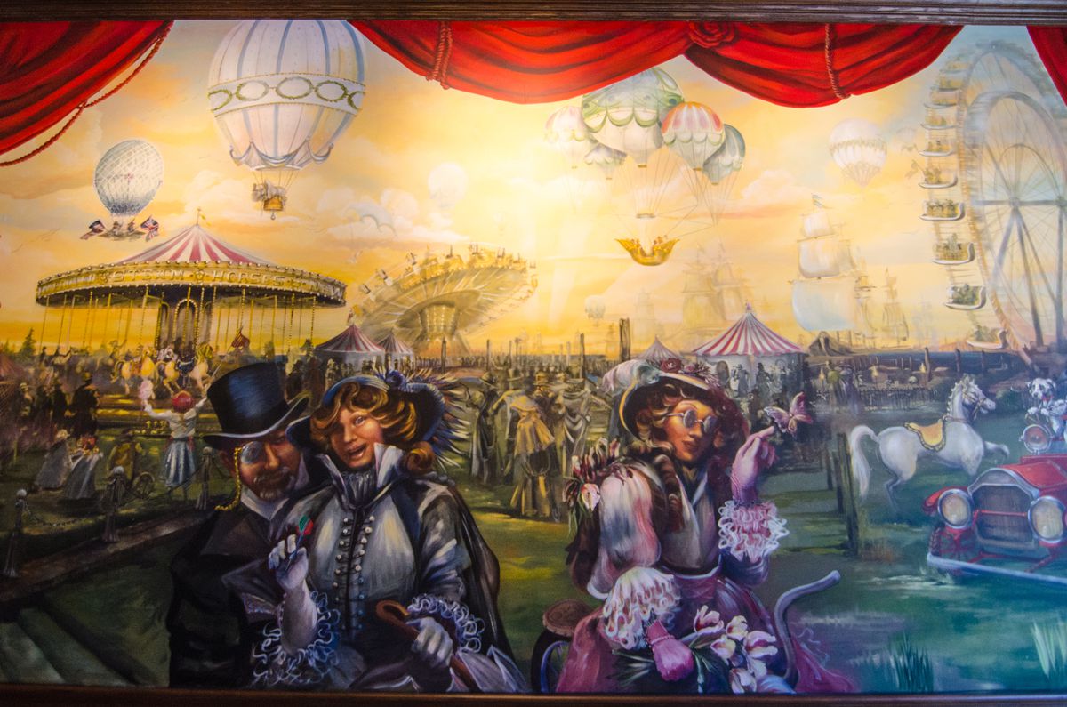 A carnival-inspired mural with a carousel, Ferris wheel, and people in Victorian dress.