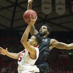 Utah guard Lorenzo Bonam (15) goes up for a layup as Butler forward Tyler Wideman (4) closes in during an NCAA college basketball game at the Huntsman Center in Salt Lake City on Monday, Nov. 28, 2016. Butler took down Utah 68-59 to remain undefeated.