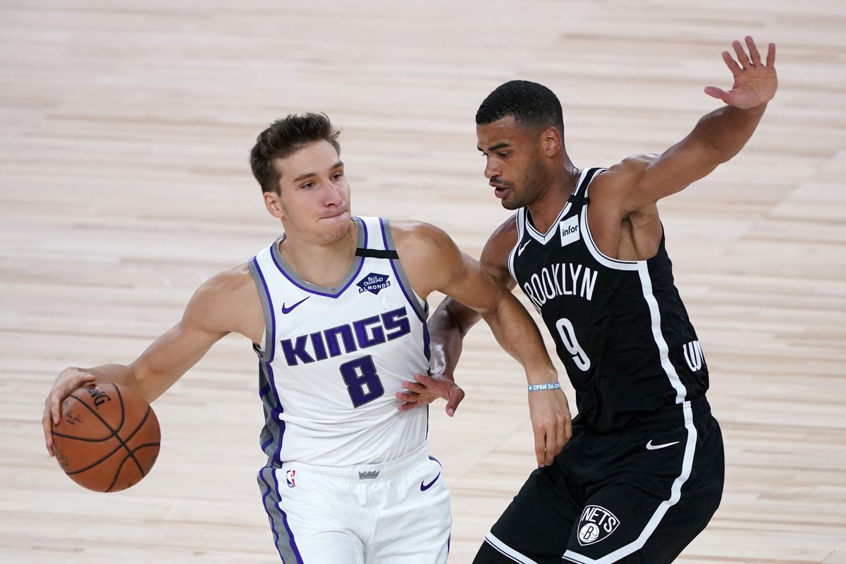 Bogdan Bogdanovic of the Sacramento Kings drives to the basket against Timothe Luwawu-Cabarrot of the Brooklyn Nets during the first half of an NBA basketball game at the ESPN Wide World Of Sports Complex on August 7, 2020 in Lake Buena Vista, Florida.