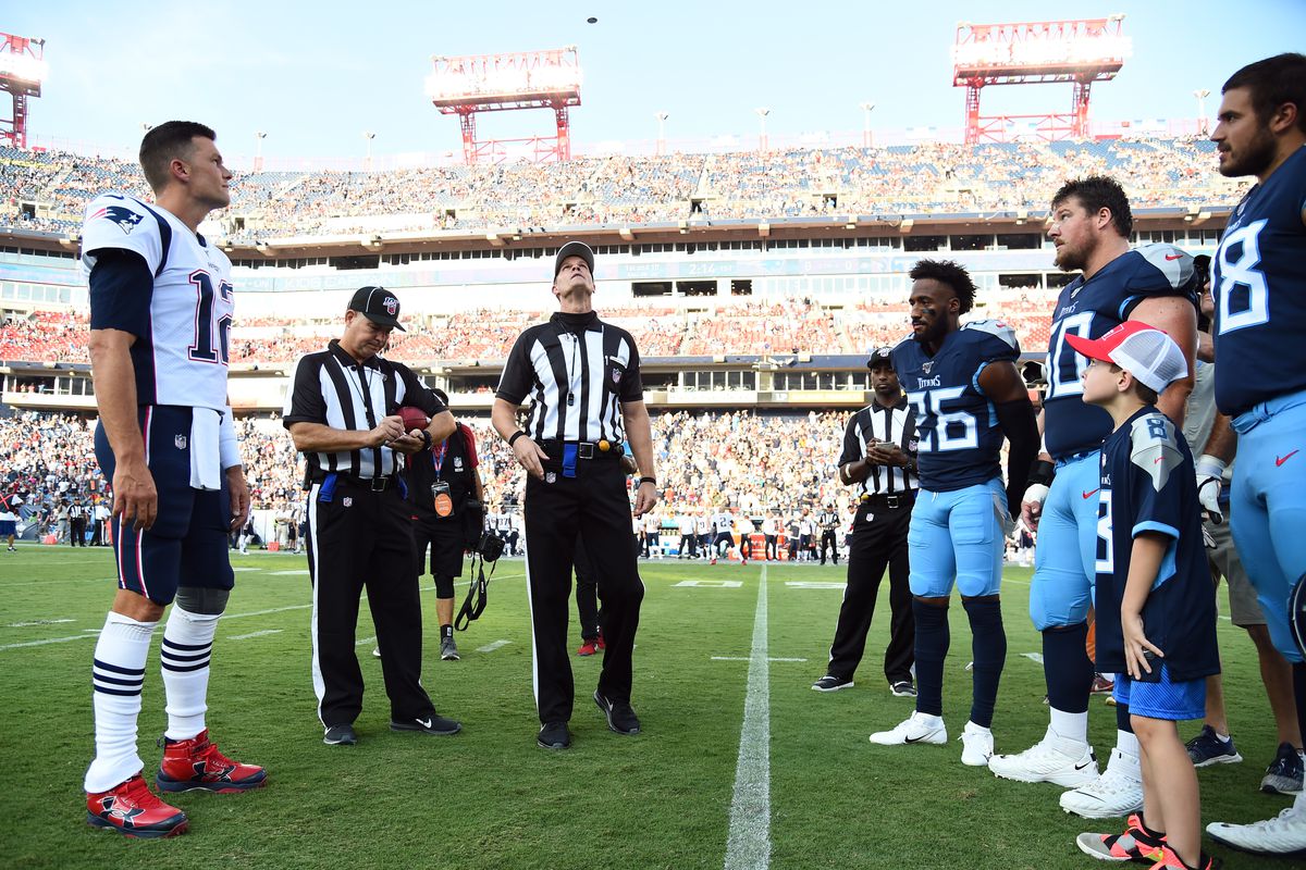 New England Patriots quarterback Tom Brady watches the coin toss as the only captain for the Patriots before the preseason game against the Tennessee Titans at Nissan Stadium.