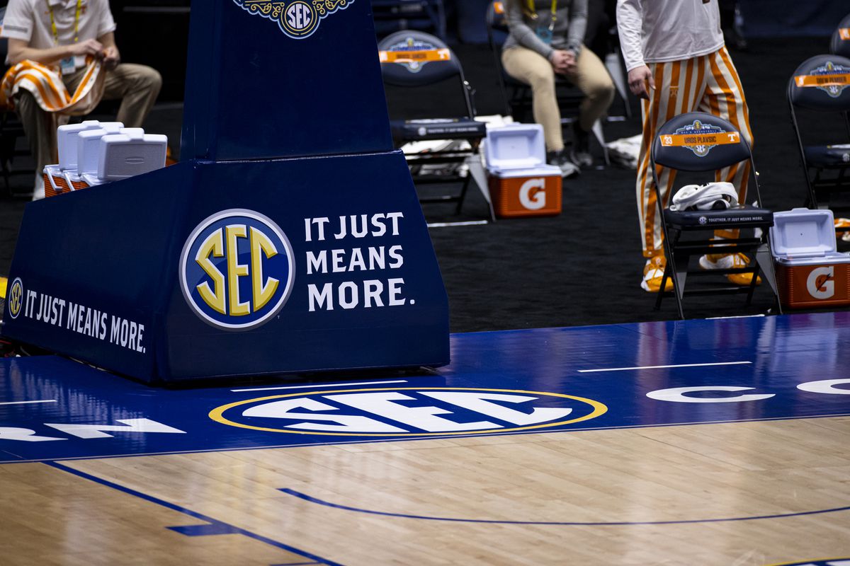 Detail view of the SEC logo with “u201cit just means more”u201d slogan during the first half of the quarterfinal game between the Florida Gators and the Tennessee Volunteers in the SEC Men’s Basketball Tournament at Bridgestone Arena on March 12, 2021 in Nashville, Tennessee.