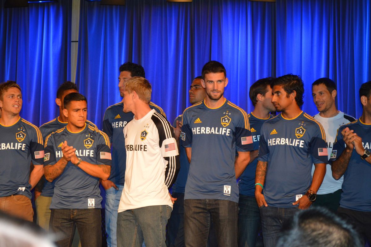 LA Galaxy players model the new second shirt to be worn this season. 