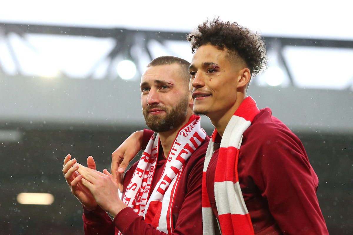 Nathaniel Phillips and Rhys Williams of Liverpool applauds the fans after the Premier League match between Liverpool and Crystal Palace at Anfield on May 23, 2021 in Liverpool, England.&nbsp;