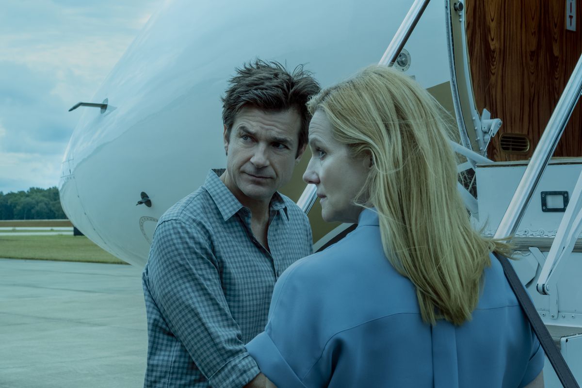 Marty and Wendy Byrde (Jason Bateman and Laura Linney) board an airplane in a still from Netflix’s Ozark.