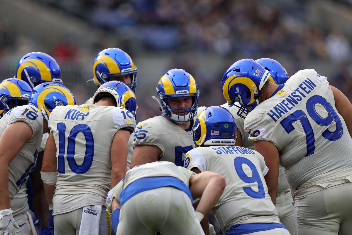 Quarterback Matthew Stafford #9 of the Los Angeles Rams and the offense huddle during the first half against the Baltimore Ravens at M&amp;T Bank Stadium on January 02, 2022 in Baltimore, Maryland.