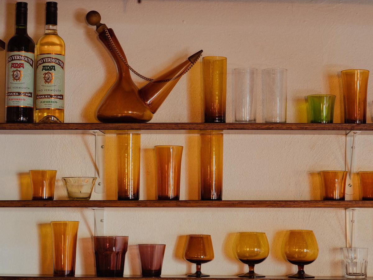 Shelves of amber glassware, including a poron.