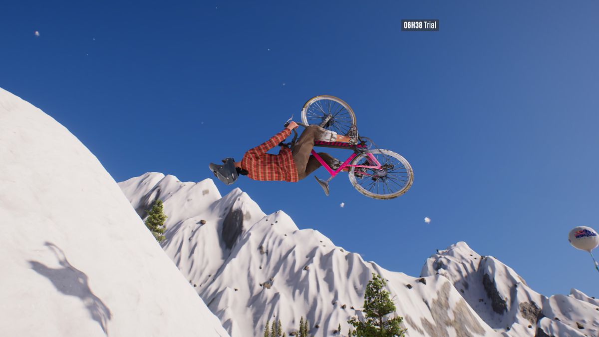 A woman on a mountain bike is doing a backflip on a snow-covered mountain in the Riders Republic.