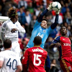 Vancouver Whitecaps' goalkeeper Joe Cannon, center, makes the save as Real Salt Lake's Olmes Garcia, right, of Colombia, and Alvaro Saborio, bottom, of Costa Rica, watch while Whitecaps' Darren Mattocks, upper left, of Jamaica, and Andy O'Brien, lower left, of England, defend during the second half of an MLS soccer game in Vancouver, British Columbia, on Saturday, April 13, 2013. (AP Photo/The Canadian Press, Darryl Dyck)