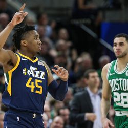 Utah Jazz guard Donovan Mitchell (45) celebrates a point during the game against the Boston Celtics at Vivint Smart Home Arena in Salt Lake City on Wednesday, March 28, 2018.