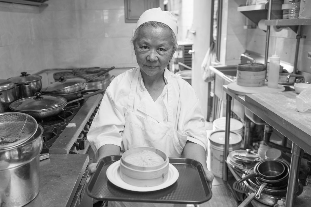Chef Qihui Guan with a giant dumpling